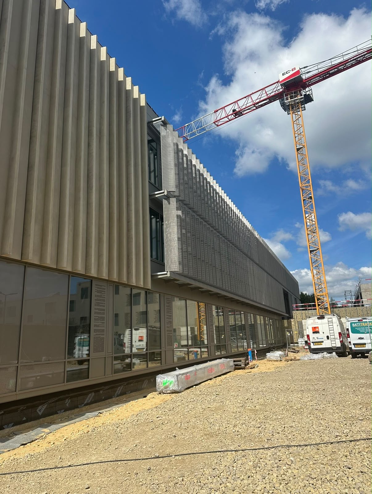 Precast façade fins and crane on the Mersch site