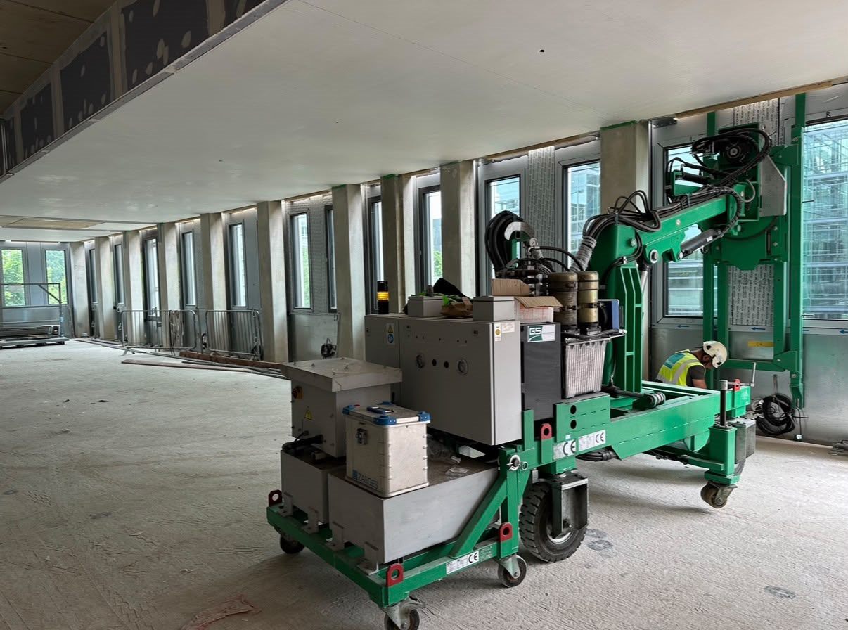Glass vacuum lifter moving glazed units inside the building