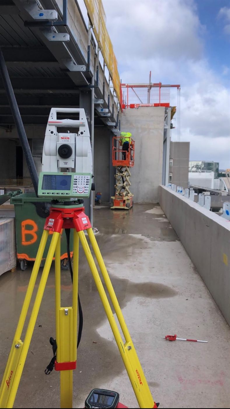 Surveying total station set up on site for façade setting-out