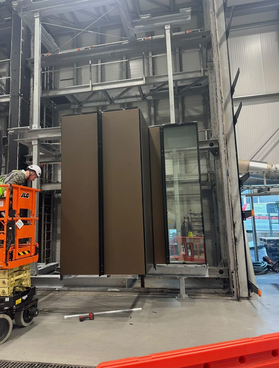 Unitised façade panels assembled on a rig in the workshop